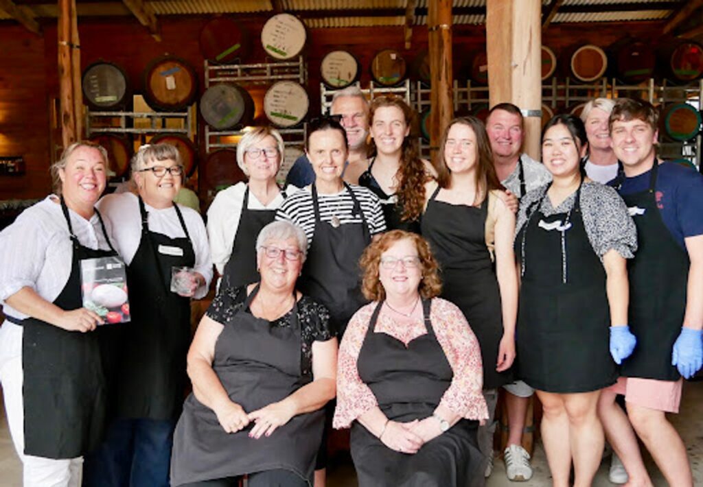 A group of happy guests at a Fleurieu cooking class