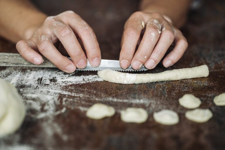 Cutting gnocchi on a floured board